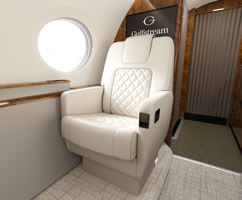 A Gulfstream G300 interior focused on a comfortable, cream-colored leather seat.