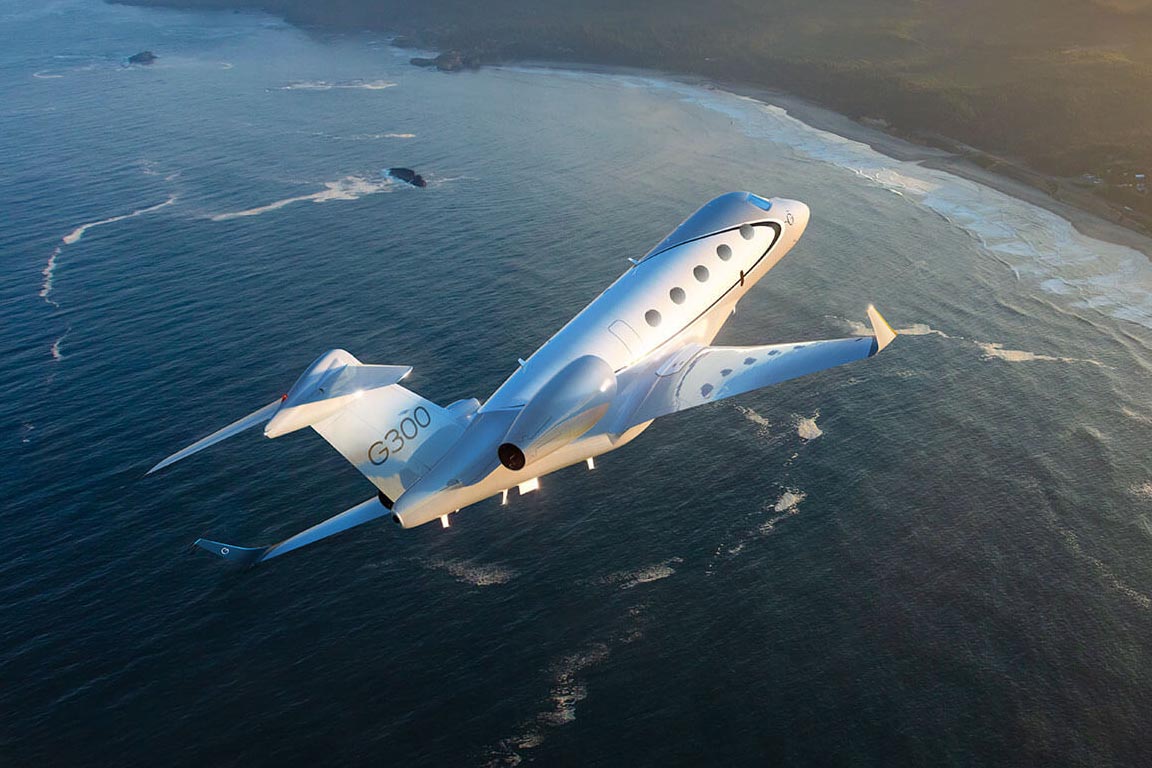 G300 flying over a large body of water dotted with small land masses